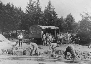 Forced laborers cut quarried stones outside the Buchenwald concentration camp